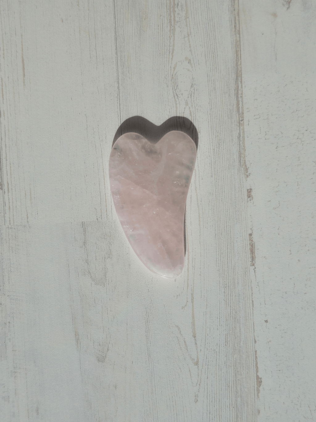 Masajeador gua sha de cuarzo rosa