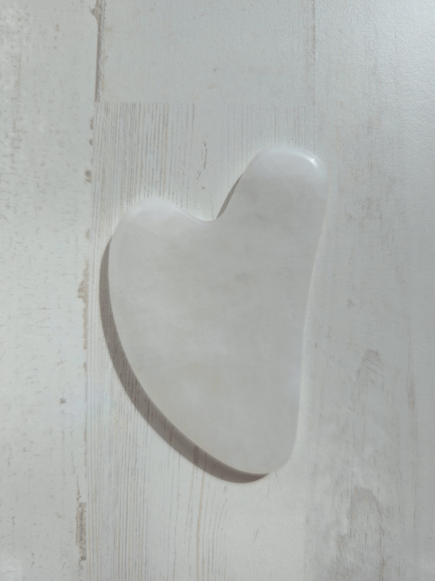 Masajeador gua sha de cuarzo blanco