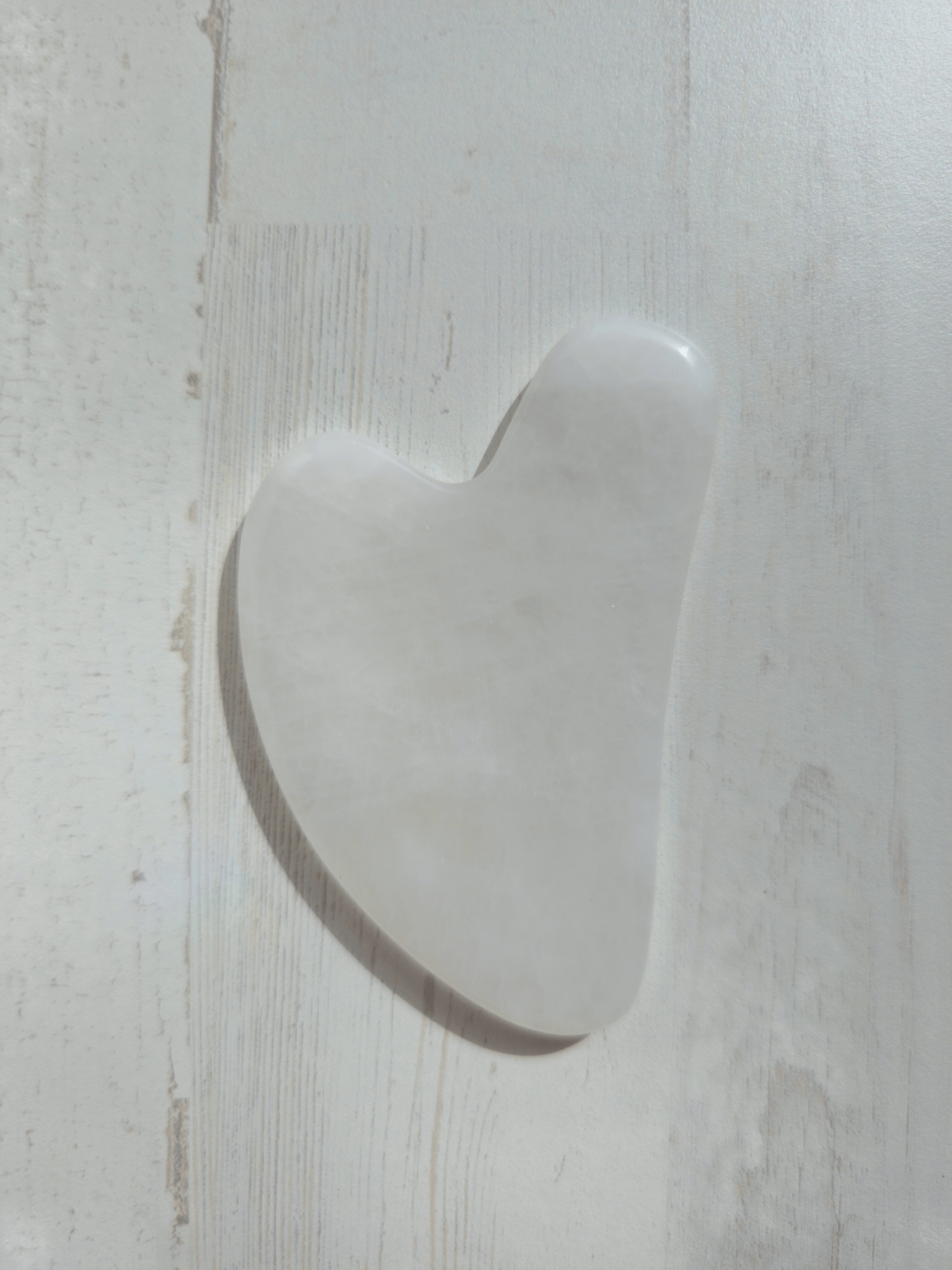 Masajeador gua sha de cuarzo blanco