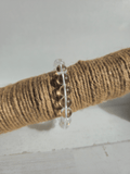 Pulsera de cuarzo blanco natural con bolas de 10 mm, montada en hilo elástico, ideal para claridad mental y equilibrio energético.