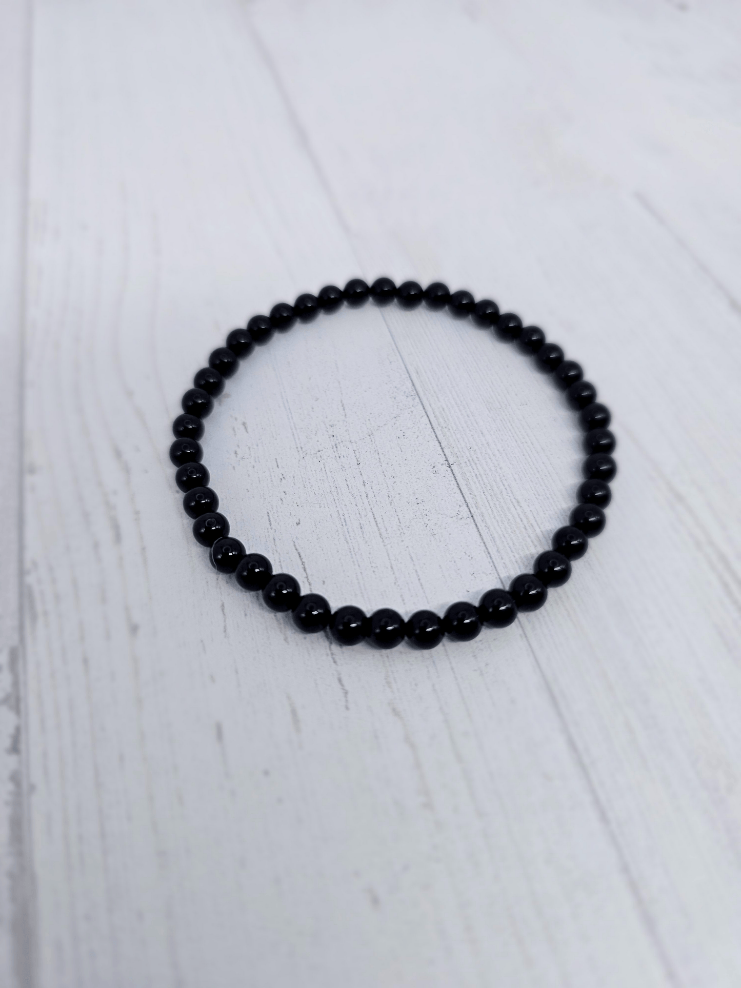 Pulsera de turmalina negra bola 4 mm | Protección energética y enraizamiento.