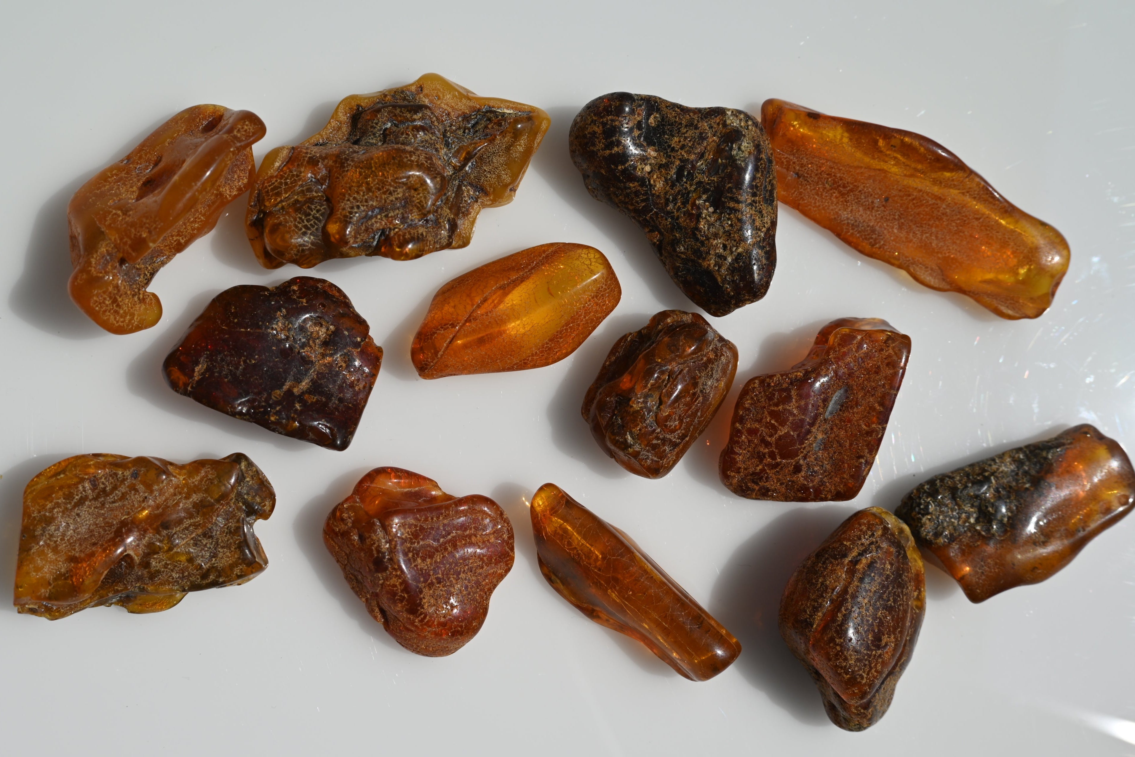 Rodado de ámbar primera calidad 30–60 mm en tonos miel