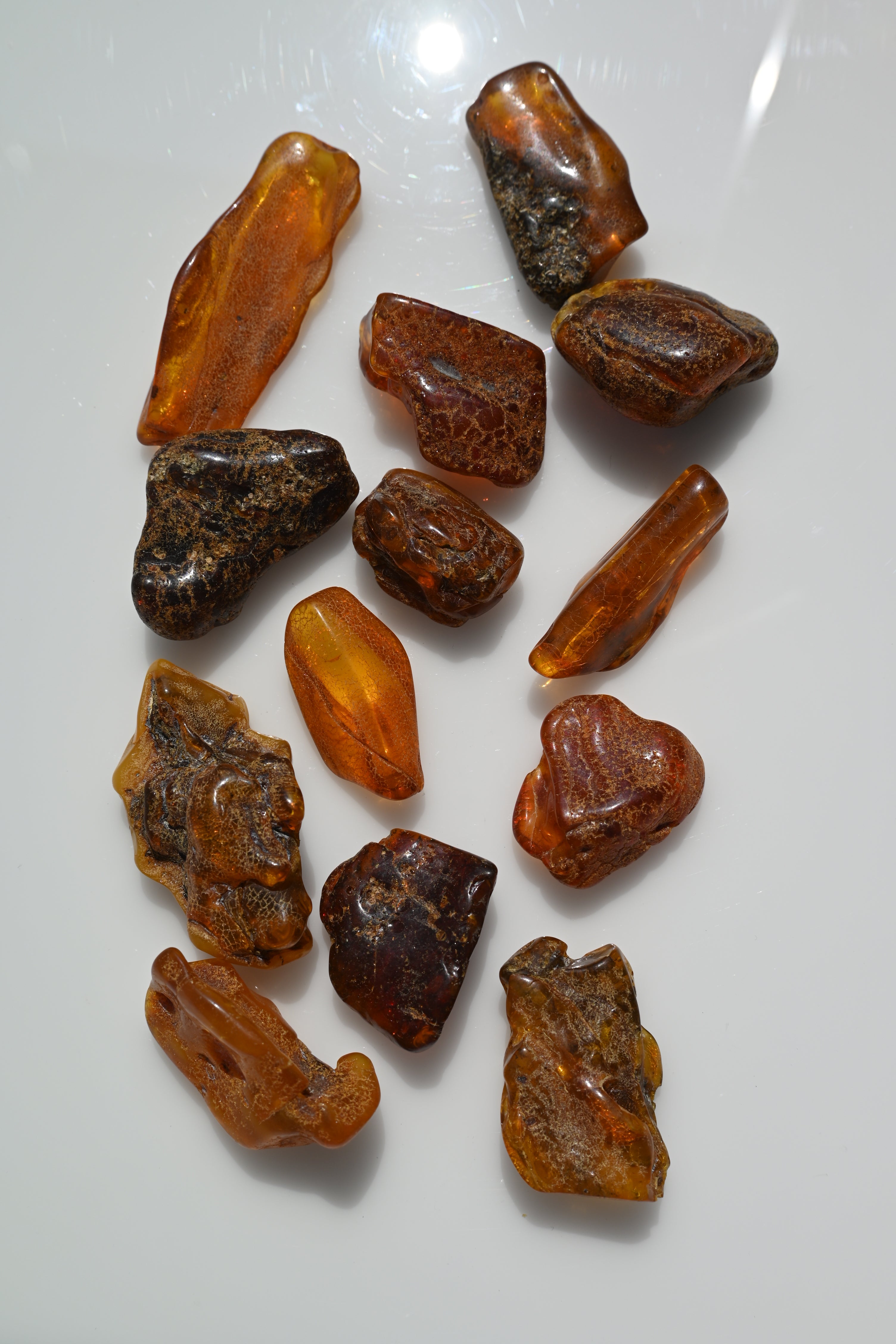 Rodado de ámbar primera calidad 30–60 mm en tonos miel